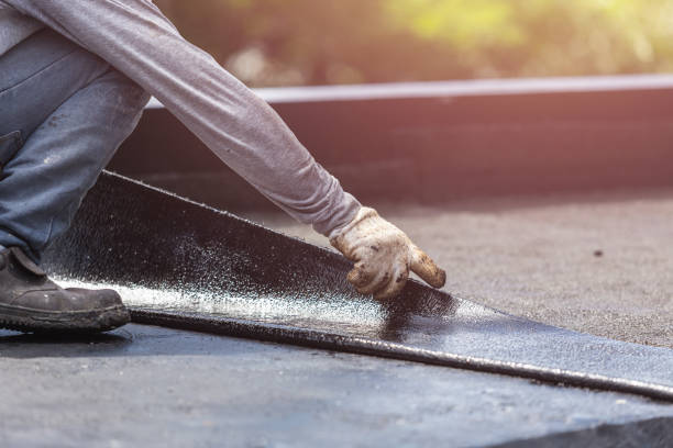Professional Emergency Waterproofing technician working in Howard City, MI